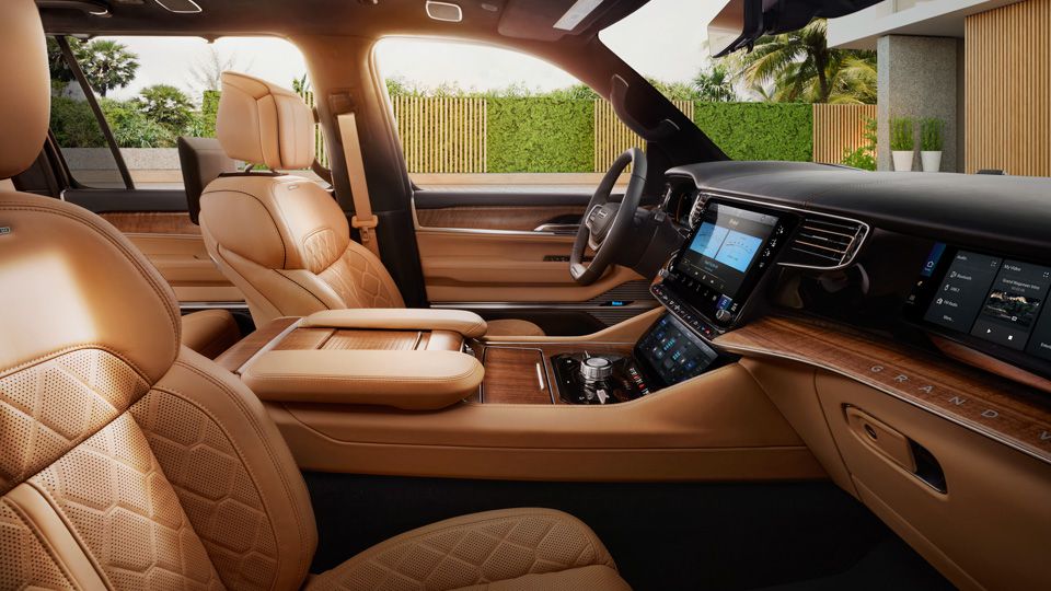 2022 Jeep Grand Wagoneer side view of luxurious interior parked in a Stuart, FL driveway.