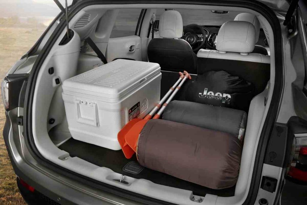 The all-new 2022 Jeep Compass trunk holds a cooler, paddles, tents, and much more comfortably with room to spare.
